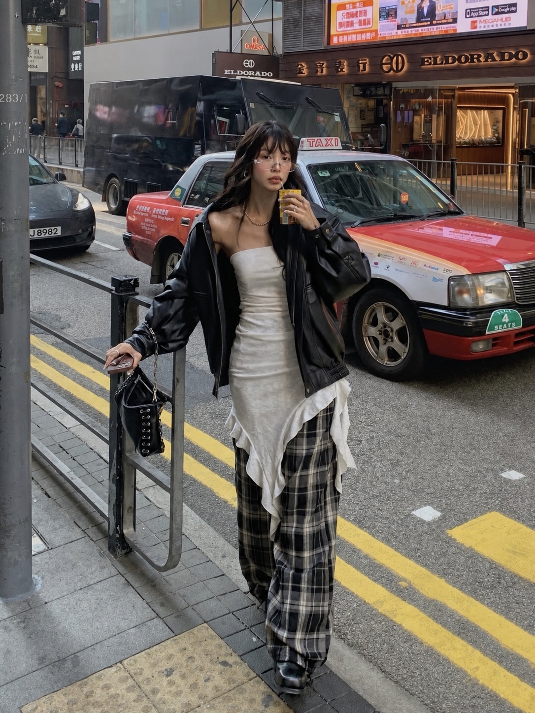 Streetwear outfit with off-shoulder top, denim and compact handbag styling