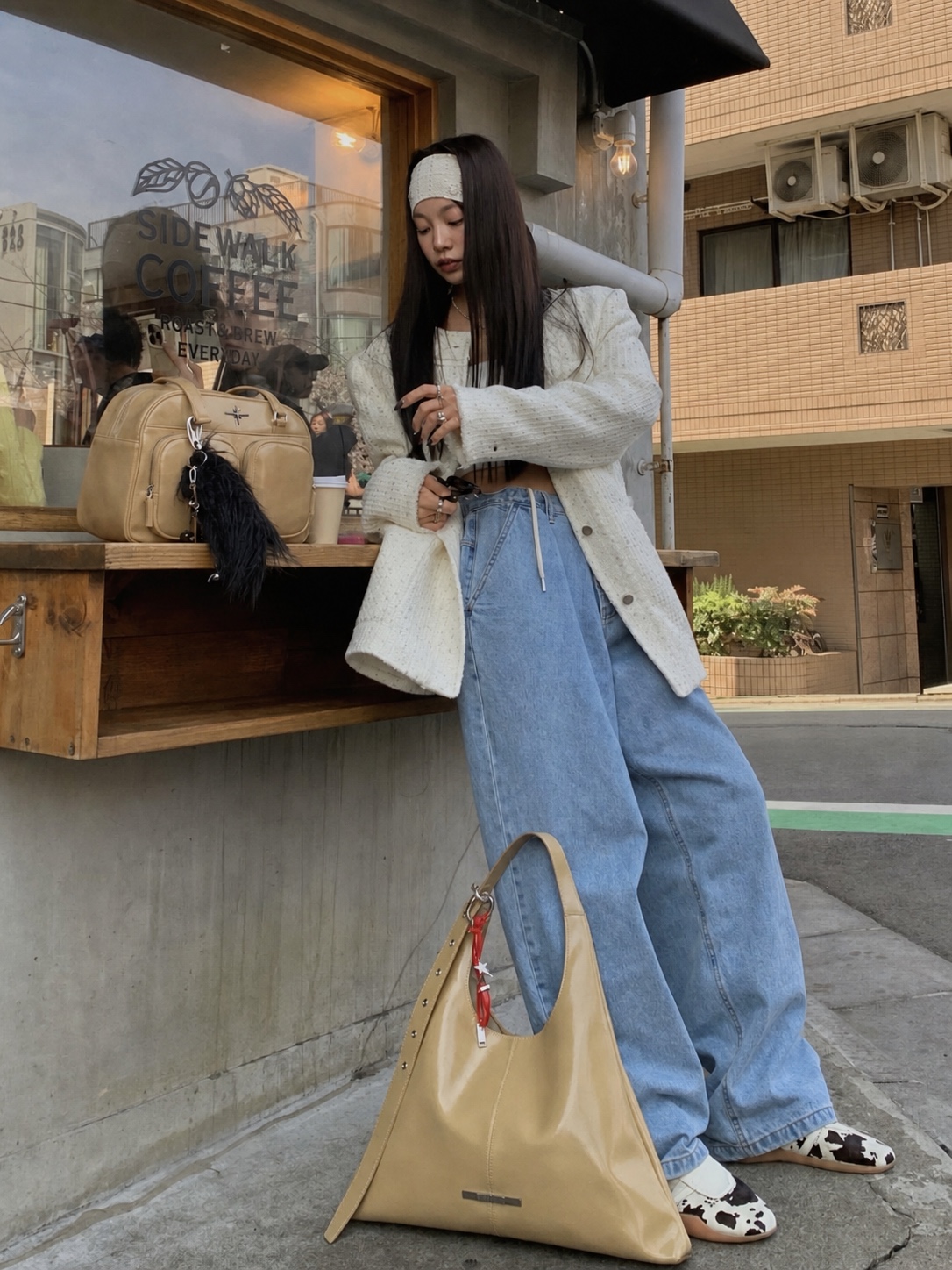 Y2K street style with mini skirt, boots and layered outerwear