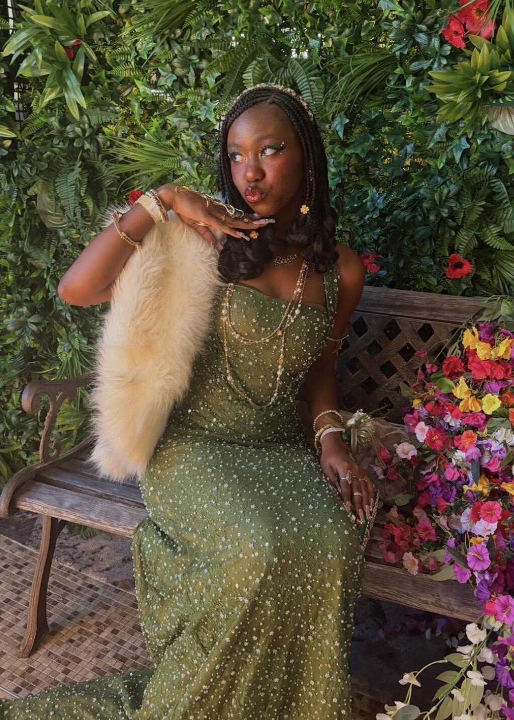 Green sequin gown with white fur and gold jewellery for a glamorous garden-princess finish